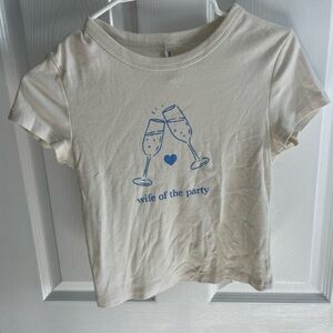Cream T-Shirt with Blue Graphic “wife of the party”